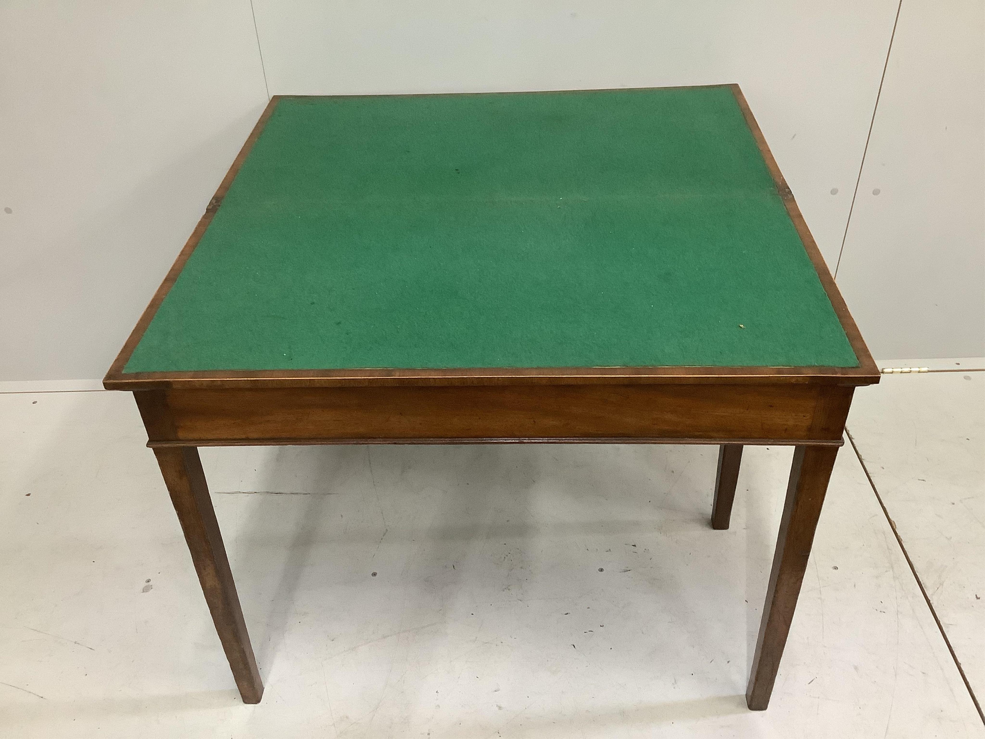 A George III rectangular mahogany folding card table, width 91cm, depth 45cm, height 73cm. Condition - poor